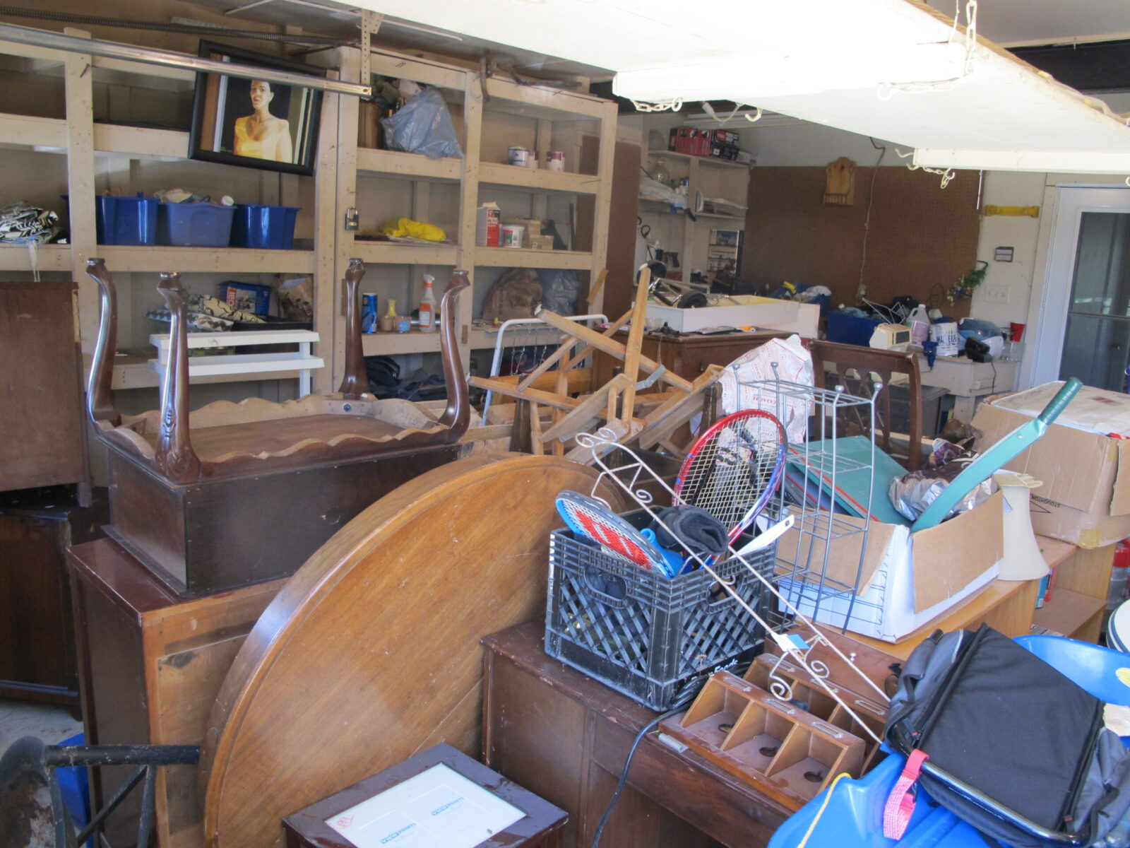 A Greenway dumpster filled with leftover materials from a basement cleanup.