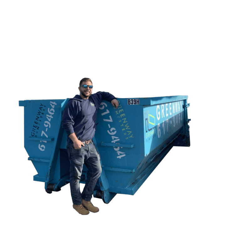 Jordan standing in front of a 15-yard dumpster for scale.