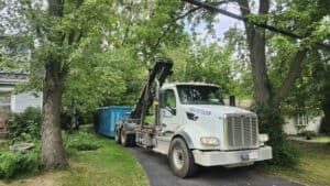 Greenway Dumpsters truck unloading a roll-off dumpster for a customer in the Indianapolis area.