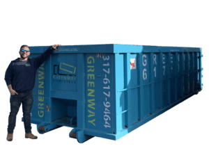 Jordan standing in front of a 30-yard dumpster for size comparison.