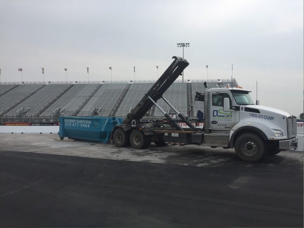 Dumpster Unloading at Indianapolis Speedway A dumpster being unloaded at the Indianapolis Speedway