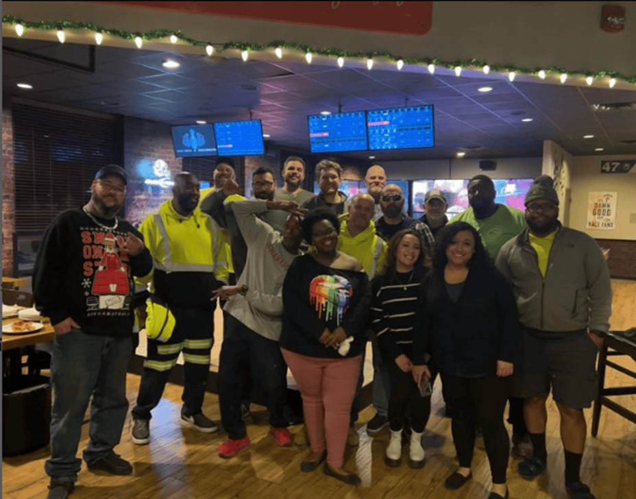 The team standing together to represent exceptional service.